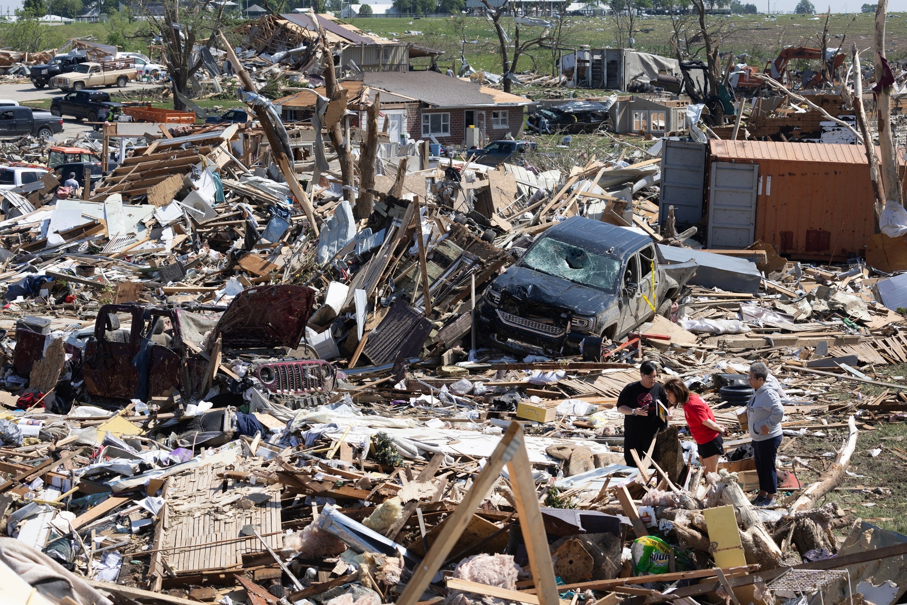 PHOTO: In this May 22, 2024, file photo, residents and first responders go through the damage after a tornado tore through Greenfield, Iowa. 