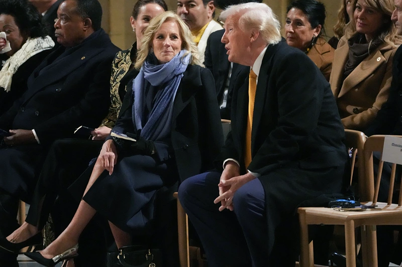 US First Lady Jill Biden (CL) listens to US President-elect Donald Trump sits during a ceremony to mark the re-opening of the landmark Notre-Dame Cathedral in central Paris on December 7, 2024. Around 50 heads of state and government are expected in the French capital to attend the ceremony marking the rebuilding of the Gothic masterpiece five years after the 2019 fire which ravaged the world heritage landmark and toppled its spire. Some 250 companies and hundreds of experts were part of the five-year restoration project at a cost of hundreds of millions of euros. (Photo by Thibault Camus / POOL / AFP) (Photo by THIBAULT CAMUS/POOL/AFP via Getty Images)