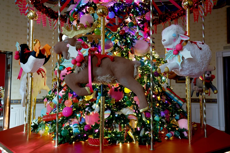 A carousel surrounds the White House Christmas Tree during a media preview of the 2024 holiday decorations at the White House on December 02, 2024 in Washington, DC. The theme for this year's White House holiday decorations is “Season of Peace and Light.” (Photo by Anna Moneymaker/Getty Images)