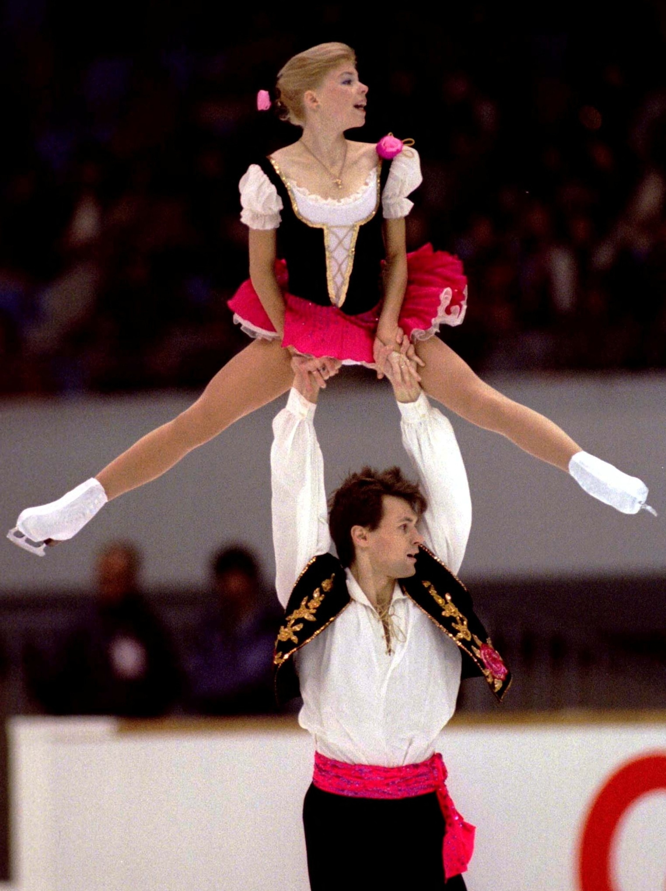 PHOTO: FILE PHOTO: Russia's Vadim Naumov lifts up his partner Evgenia Shishkova during the free skating to win the pairs event of the NHK Trophy figure skating grand prix in Nagoya