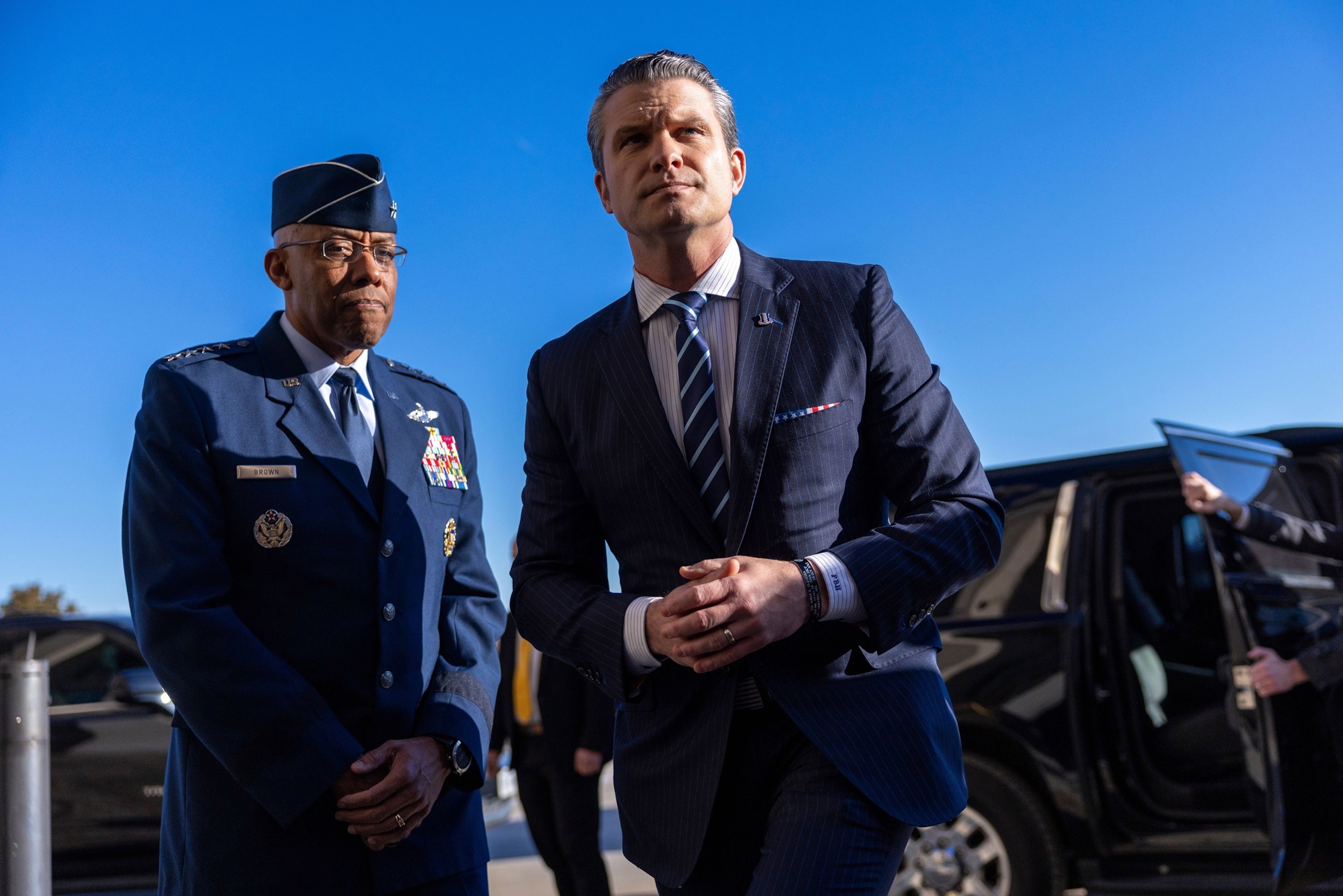 PHOTO: Sec. of Defense Pete Hegseth responds to a question from the news media after being greeted by Chairman of the Joint Chiefs of Staff, Charles Q. Brown Jr. as he arrives for his first official day at the Pentagon in Arlington, Va., Jan. 27, 2025.