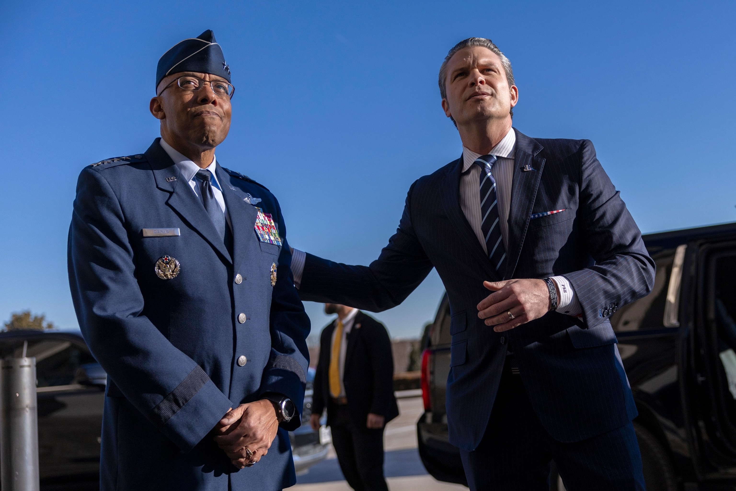 PHOTO: Sec. of Defense Pete Hegseth responds to a question from the news media after being greeted by Chairman of the Joint Chiefs of Staff, Charles Q. Brown Jr. as he arrives for his first official day at the Pentagon in Arlington, Va., Jan. 27, 2025.