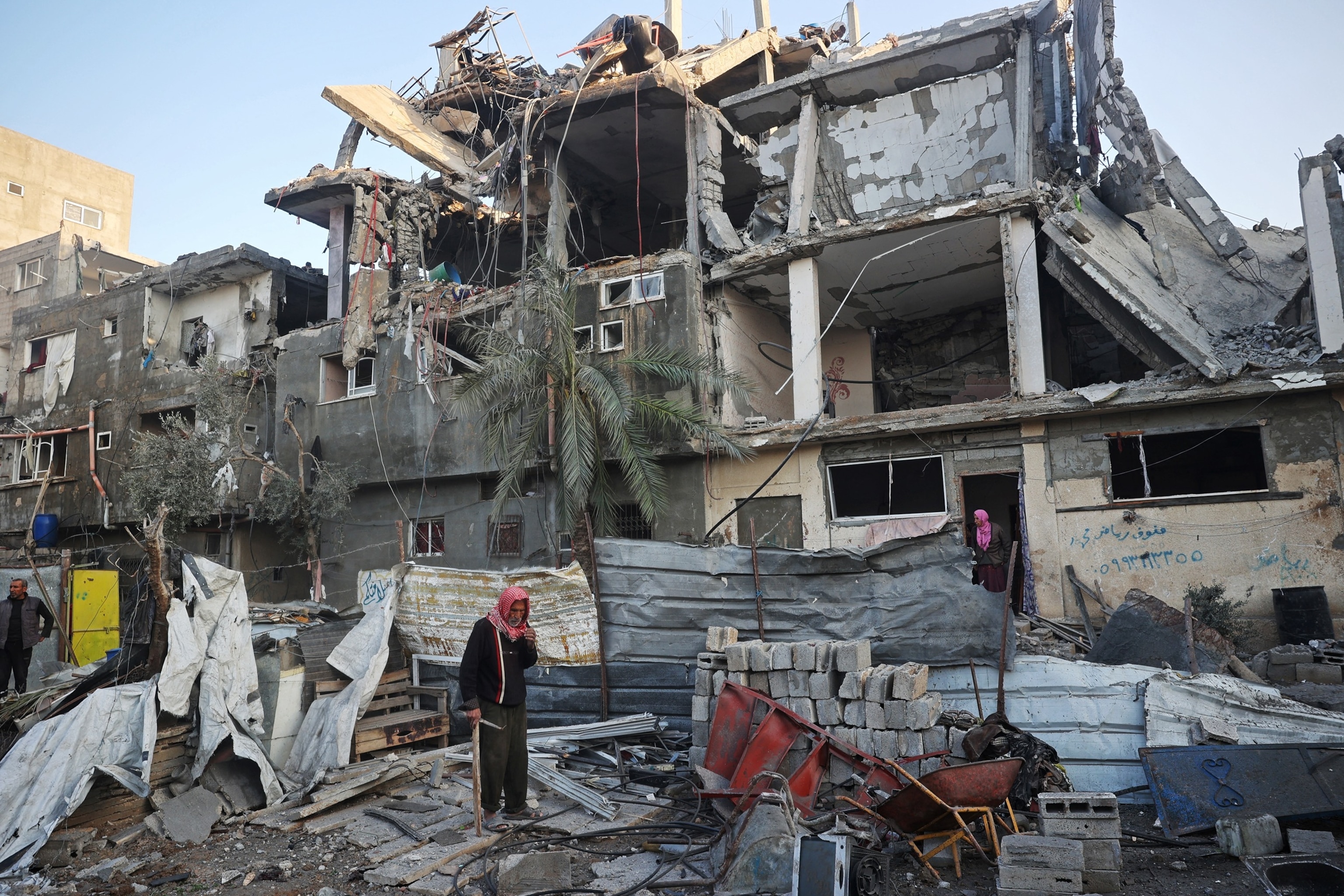 PHOTO: People look for their belongings amid the debris of a destroyed building following an Israeli air strike on Bureij camp for Palestinian refugees in the central Gaza Strip, Jan. 6, 2025. 