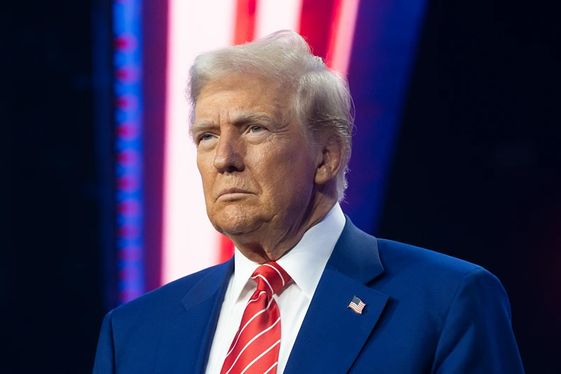 : U.S. President-elect Donald Trump looks on during Turning Point USA's AmericaFest at the Phoenix Convention Center on December 22, 2024 in Phoenix, Arizona. The annual four day conference geared toward energizing and connecting conservative youth hosts some of the country's leading conservative politicians and activists. (Photo by Rebecca Noble/Getty Images)