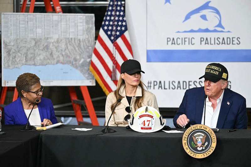 Los Angeles Mayor Karen Bass and US First Lady Melania Trump look on as US President Donald Trump speaks during a fire emergency briefing at Station 69 in Pacific Palisades, a neighborhood of Los Angeles, California, on January 24, 2025. (Photo by Mandel NGAN / AFP) (Photo by MANDEL NGAN/AFP via Getty Images)