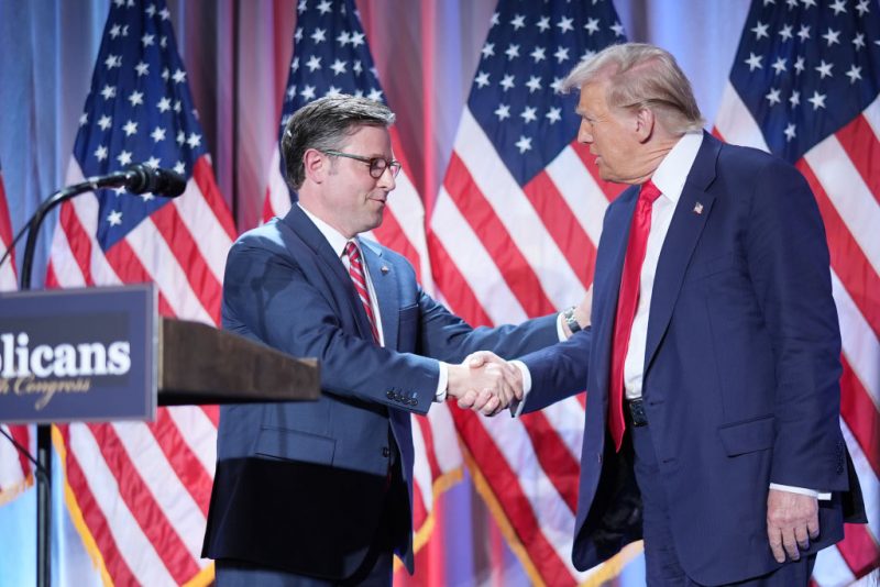 WASHINGTON, DC - NOVEMBER 13: U.S. Speaker of the House Mike Johnson shakes hands with U.S. President-elect Donald Trump onstage at a House Republicans Conference meeting at the Hyatt Regency on Capitol Hill on November 13, 2024 in Washington, DC. As is tradition with incoming presidents, Trump is traveling to Washington, DC to meet with U.S. President Joe Biden at the White House as well as meet with Republican congressmen on Capitol Hill. (Photo by Andrew Harnik/Getty Images)