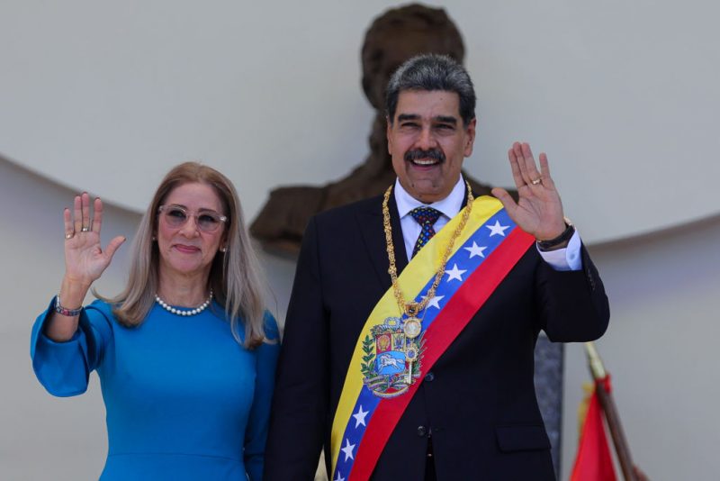 CARACAS, VENEZUELA - JANUARY 10: President of Venezuela Nicolas Maduro and his wife Cilia Flores hold hands and pose for photos after the swear-in ceremony at Palacio Federal Legislativo on January 10, 2025 in Caracas, Venezuela. Nicolas Maduro takes oath as president of Venezuela for a third consecutive term amidst tension in the country and a day after the opposition leader Maria Corina Machado was intercepted by governmental forces after taking part in an anti-government rally. Maduro claims to have won the election while the opposition leader Edmundo Gonzalez affirms he has won and, consequently, he is the legitimate president of Venezuela. (Photo by Jesus Vargas/Getty Images)