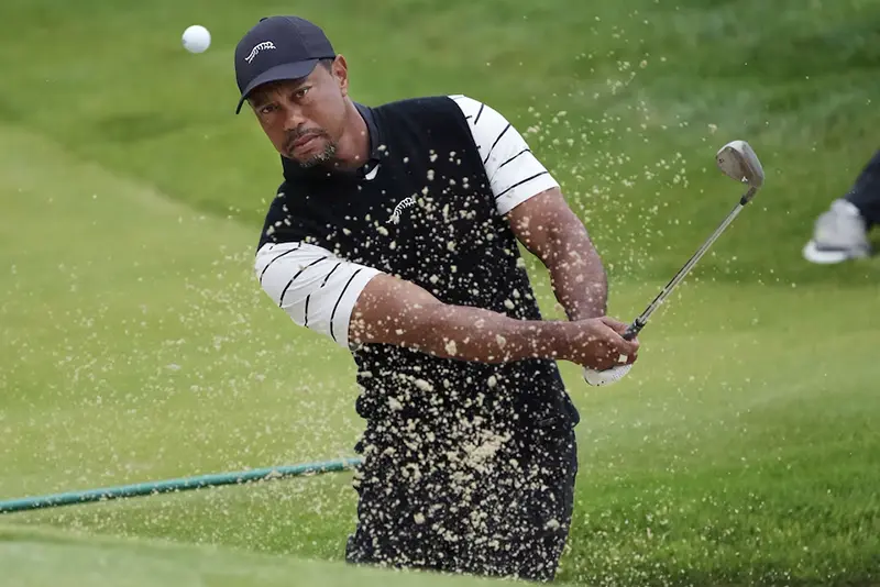 Tiger Woods hits a bunker shot on the 3rd green during a practice round for the PGA Championship golf tournament at Valhalla Golf Club. Mandatory Credit: Sam Upshaw Jr.-USA TODAY Sports