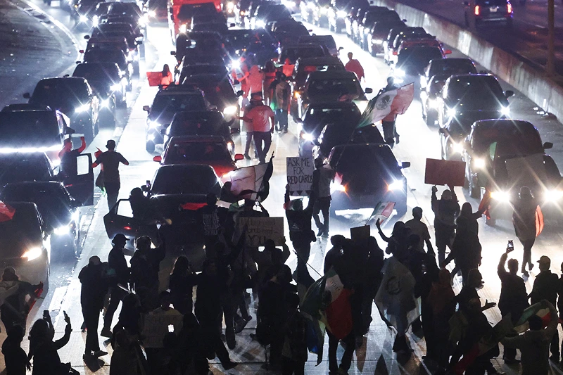 LOS ANGELES, CALIFORNIA - FEBRUARY 02: Anti-deportation demonstrators block the 101 freeway while protesting the Trump administration's deportations on February 02, 2025 in Los Angeles, California. Thousands marched and protested against Immigration and Customs Enforcement (ICE) and mass deportations in downtown Los Angeles, blocking the 101 freeway multiple times and creating gridlock in the area. (Photo by Mario Tama/Getty Images)