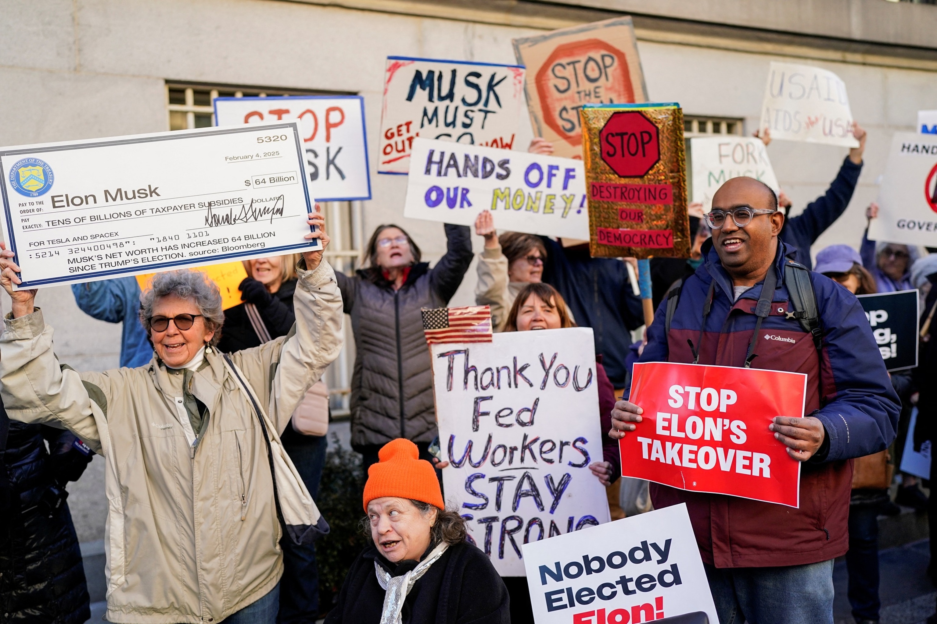 PHOTO: Demonstrators rally outside the Treasury Department after it was reported billionaire Elon Musk has gained access to the U.S. Treasury's federal payments system, in Washington, Feb. 4, 2025.