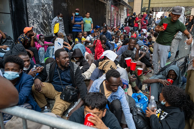 NEW YORK, NEW YORK - AUGUST 01: Dozens of recently arrived migrants to New York City camp outside of the Roosevelt Hotel, which has been made into a reception center, as they try to secure temporary housing on August 01, 2023 in New York City. The migrants, many from Central America and Africa, have been sleeping on the streets or at other shelters as the city continues to struggle with the influx of migrants whose numbers have surged this spring and summer. (Photo by Spencer Platt/Getty Images)