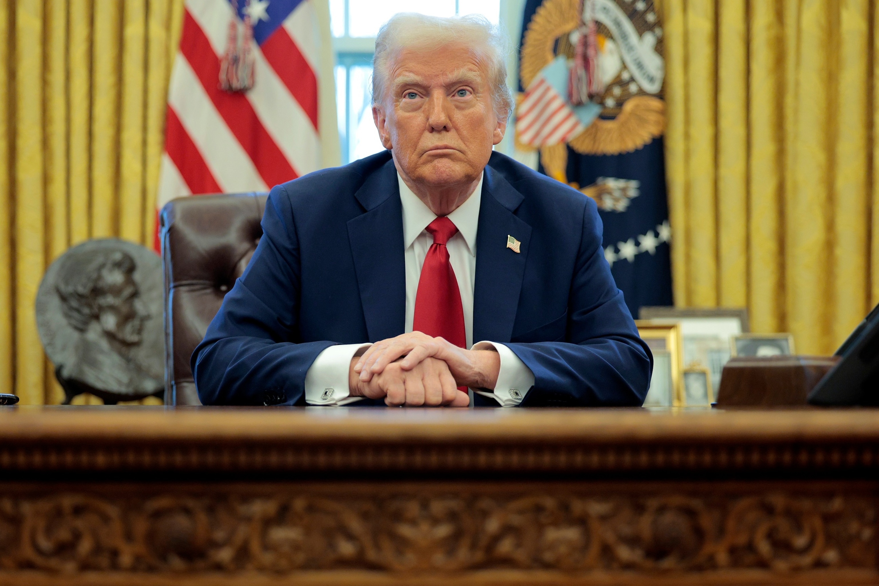 PHOTO: President Donald Trump talks to reporters after signing an executive order to appoint the deputy administrator of the Federal Aviation Administration in the Oval Office at the White House on January 30, 2025 in Washington.