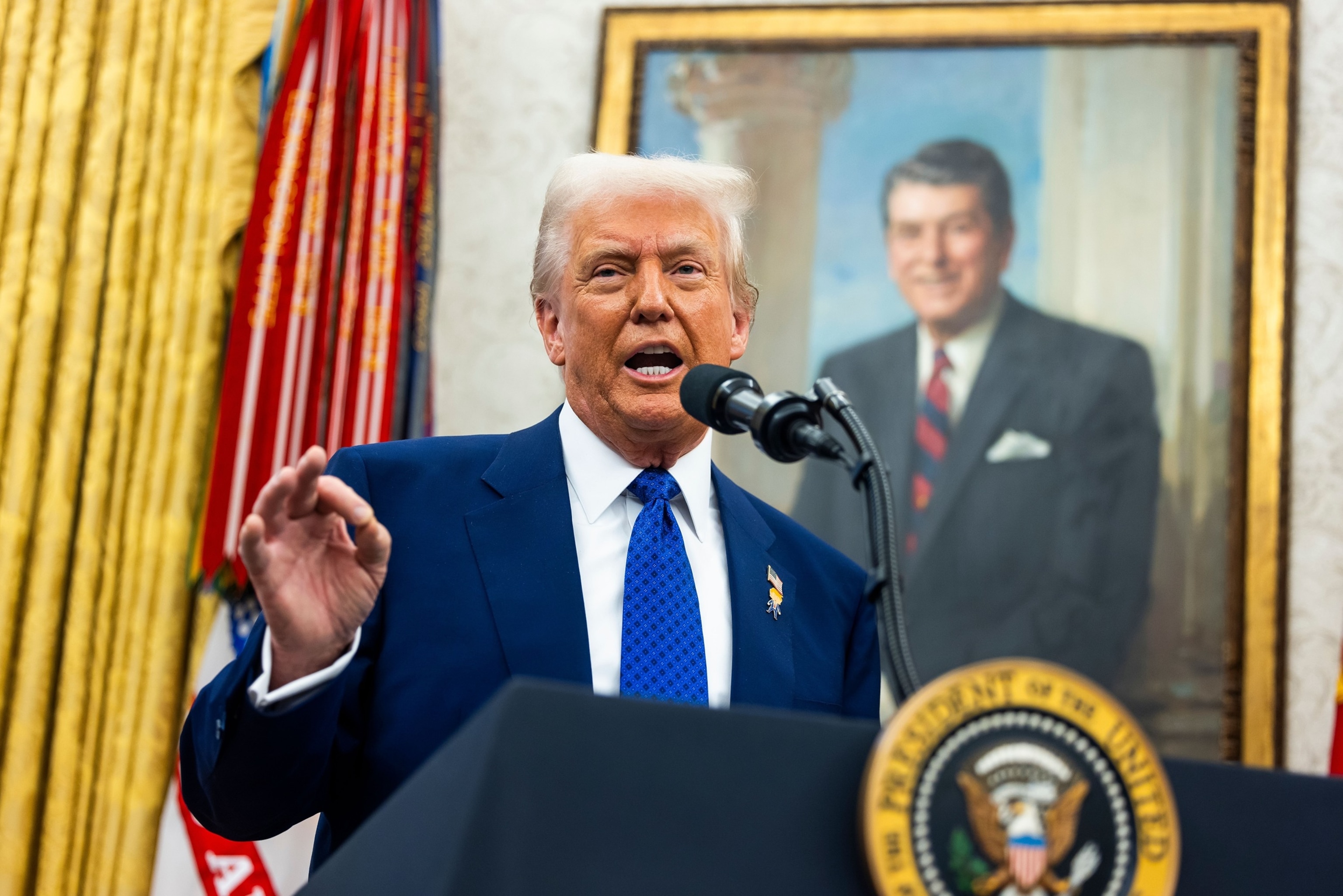 PHOTO: President Donald Trump speaks after Tulsi Gabbard was sworn in as the Director of National Intelligence in the Oval Office of the White House, Feb. 12, 2025, in Washington. 