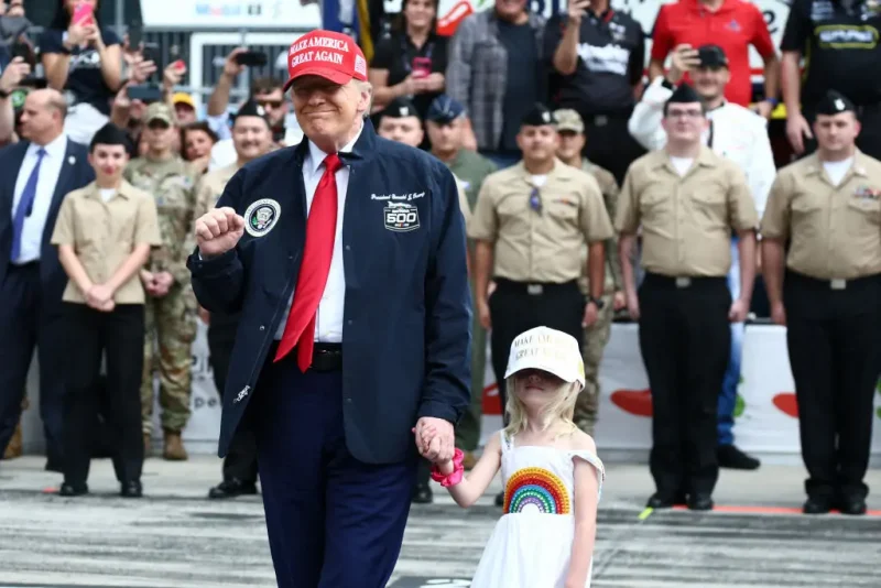 US President Donald Trump stands on the grid during pre-race ceremonies prior to the NASCAR Cup Series Daytona 500 at Daytona International Speedway on February 16, 2025 in Daytona Beach, Florida. (Photo by Chris Graythen / POOL / AFP) (Photo by CHRIS GRAYTHEN/POOL/AFP via Getty Images)