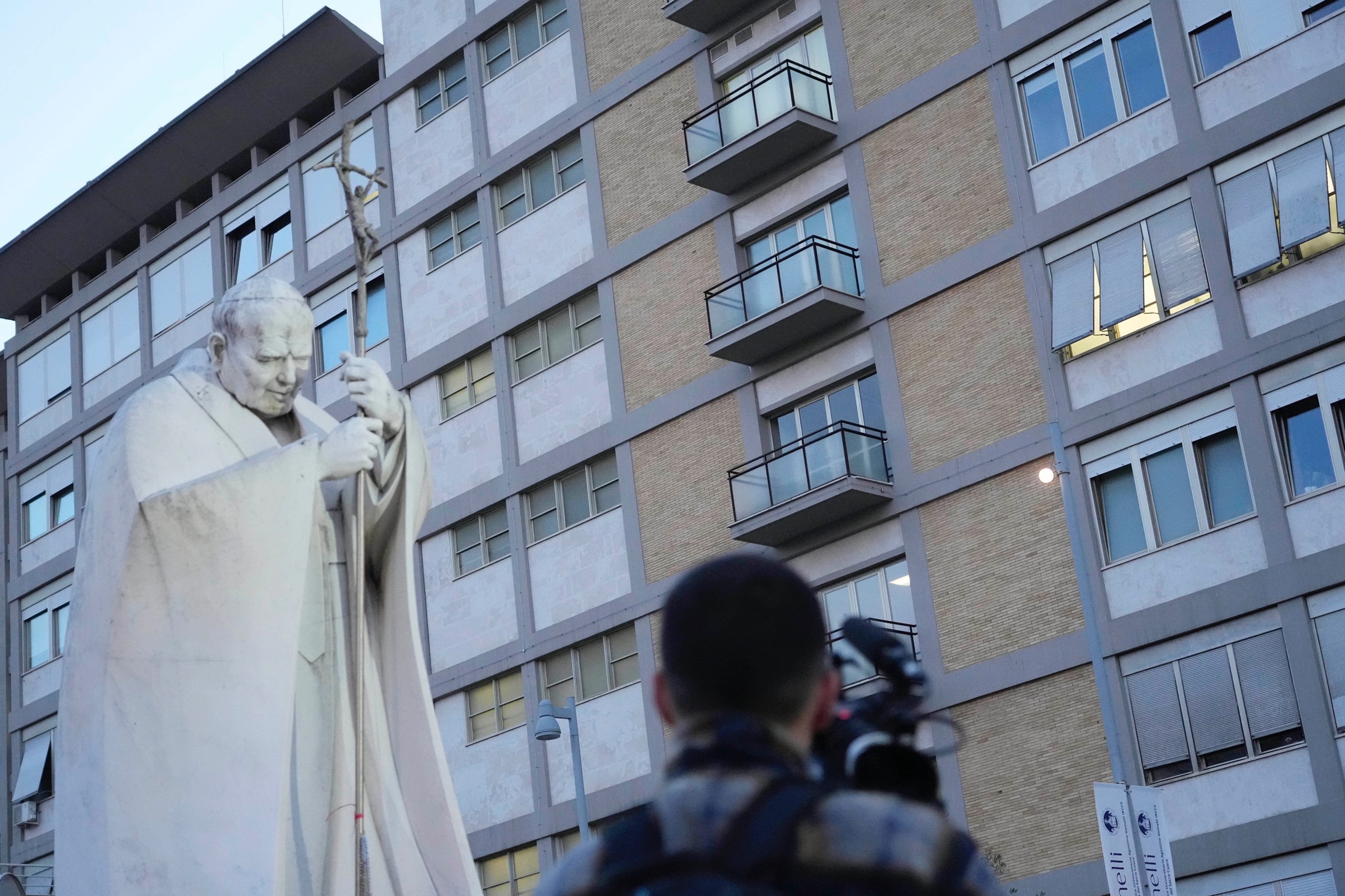 PHOTO: A video journalists films the Agostino Gemelli Polyclinic in Rome, Sunday, Feb. 23, 2025, where Pope Francis is hospitalized since Feb. 14. 