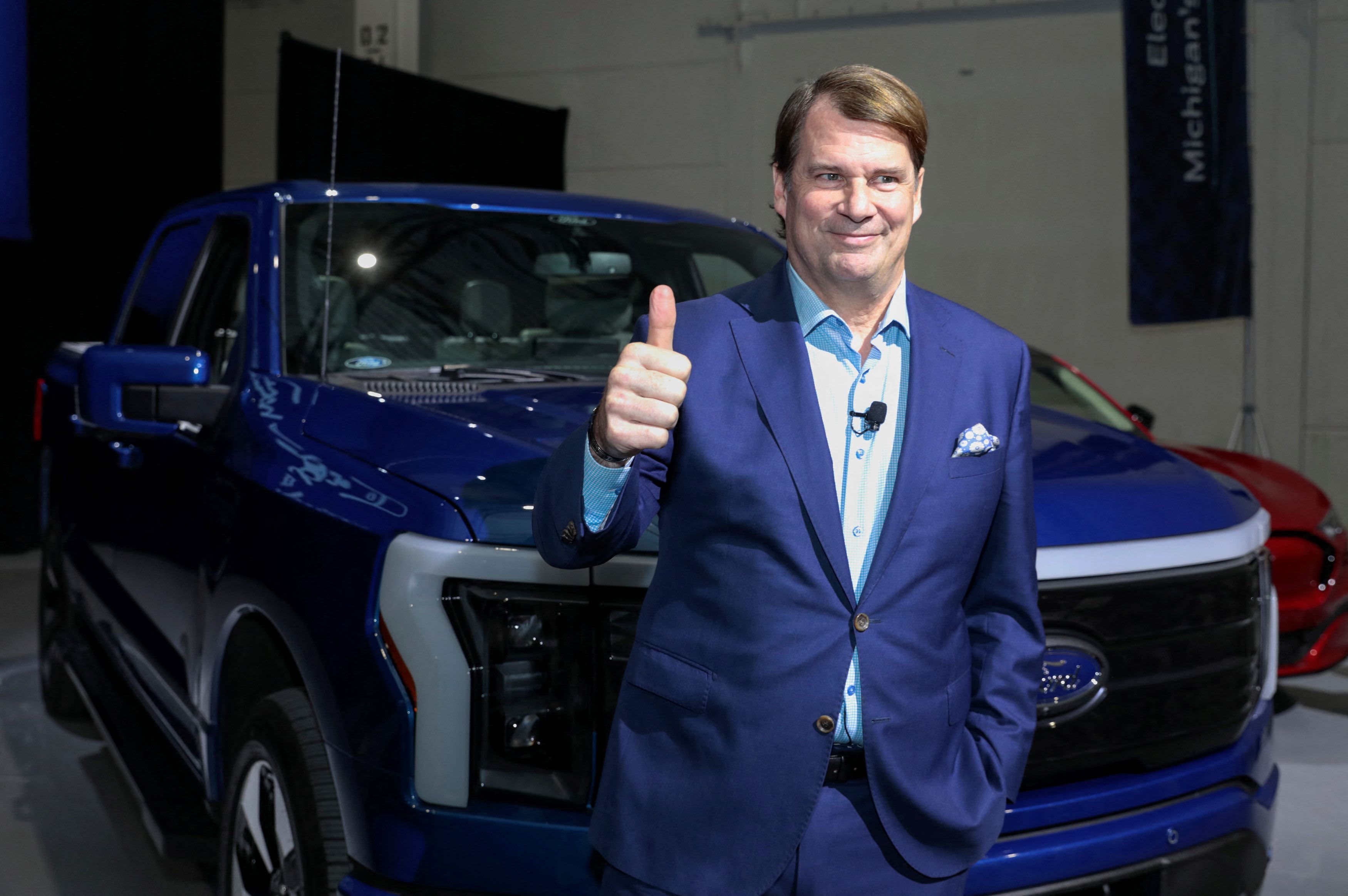 Ford Motor Co., CEO Jim Farley gives the thumbs up sign before announcing Ford Motor will partner with Chinese-based, Amperex Technology, to build an all-electric vehicle battery plant in Marshall, Michigan, during a press conference in Romulus, Michigan February 13, 2023.