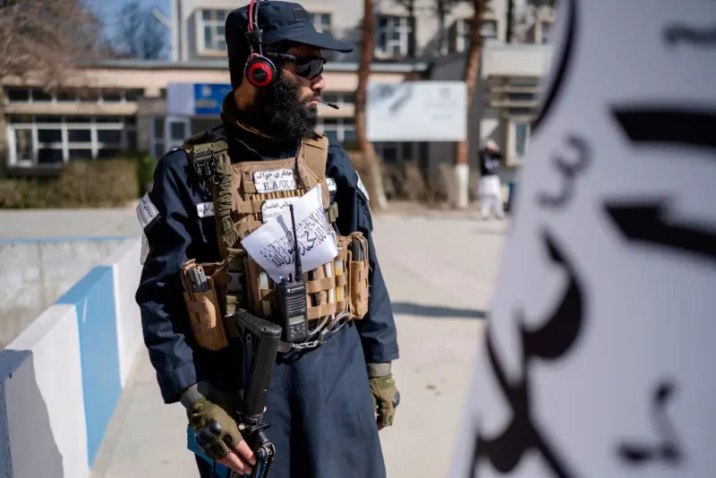 A Taliban security personnel stands guard during the ceremony held to mark the start of new academic year at Amani High School in Kabul on March 20, 2025. (Photo by Wakil KOHSAR / AFP) (Photo by WAKIL KOHSAR/AFP via Getty Images)