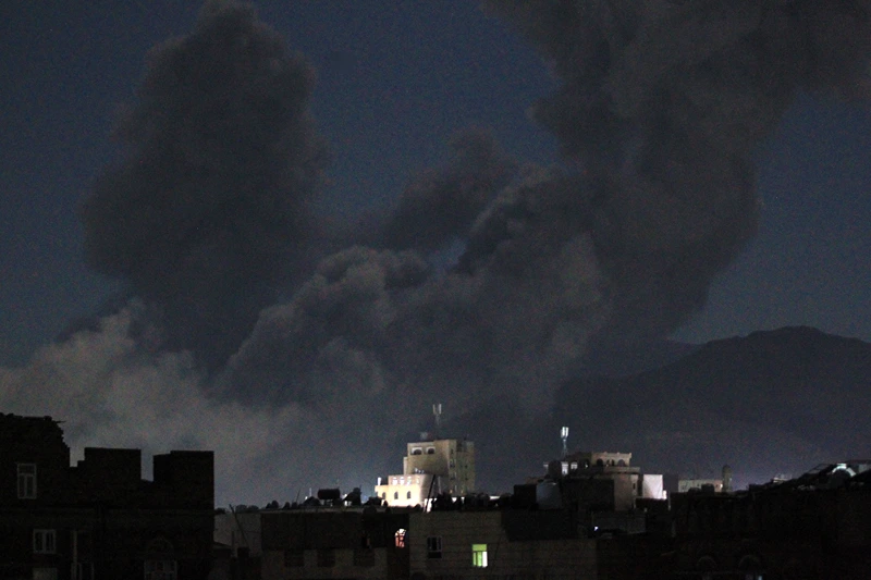 A plume of smoke billows during a US strike on Yemen's Huthi-held capital Sanaa early on March 16, 2025. The first US strikes against Yemen's Huthis since President Donald Trump took office in January killed at least 31 people, the rebels said on March 16, as Washington warned Iran to stop backing the group. (Photo by Mohammed HUWAIS / AFP) (Photo by MOHAMMED HUWAIS/AFP via Getty Images)