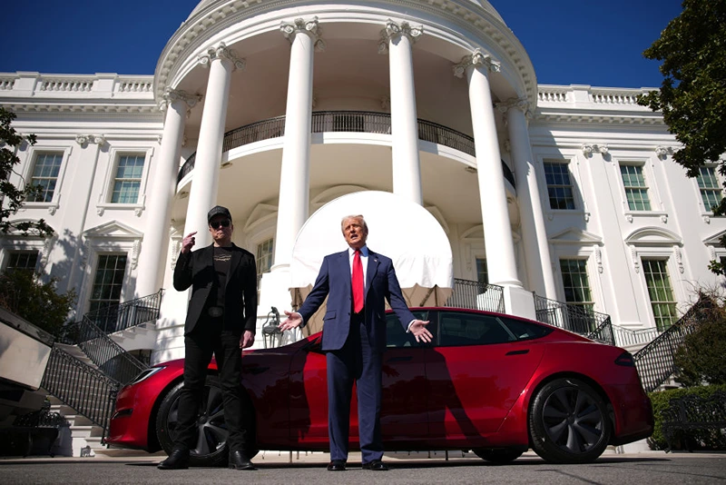 President Donald Trump and White House Senior Advisor, Tesla and SpaceX CEO Elon Musk deliver remarks next to a Tesla Model S on the South Lawn of the White House on March 11, 2025 in Washington, DC. Trump spoke out against calls for a boycott of Elon Musk’s companies and said he would purchase a Tesla vehicle in what he calls a ‘show of confidence and support’ for Elon Musk. (Photo by Andrew Harnik/Getty Images)